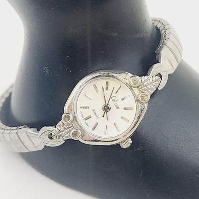 COLLEZIO QUARTZ DAINTY SILVER TONED WRIST WATCH - STRETCHY BAND