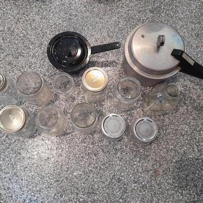 Pressure cooker, canning jars, and enamel pot with lid, and a MASON STAR JAR