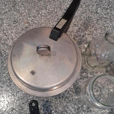 Pressure cooker, canning jars, and enamel pot with lid, and a MASON STAR JAR