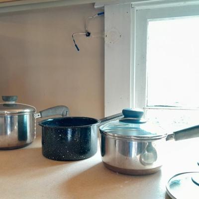 Two Stainless Revere ware saucepans with lids and an enamel pan with no lid