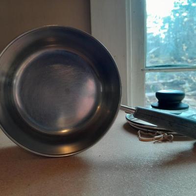 Two Stainless Revere ware saucepans with lids and an enamel pan with no lid