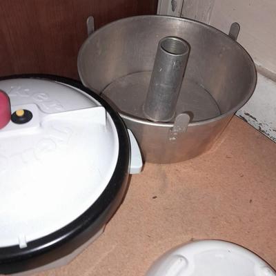 Aluminum Bundt pan, tender cooker, small Corning ware pan, and more.