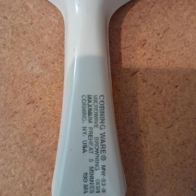 Aluminum Bundt pan, tender cooker, small Corning ware pan, and more.