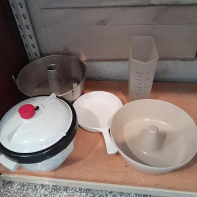 Aluminum Bundt pan, tender cooker, small Corning ware pan, and more.