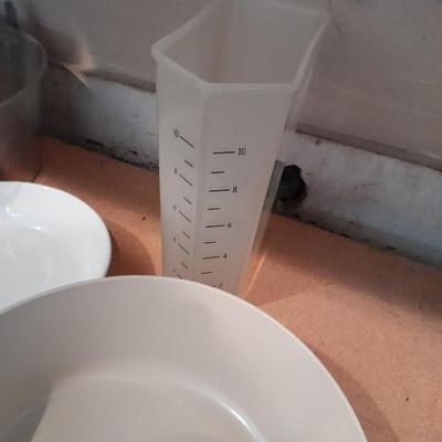 Aluminum Bundt pan, tender cooker, small Corning ware pan, and more.