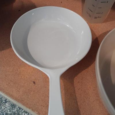 Aluminum Bundt pan, tender cooker, small Corning ware pan, and more.