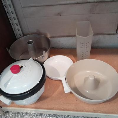 Aluminum Bundt pan, tender cooker, small Corning ware pan, and more.
