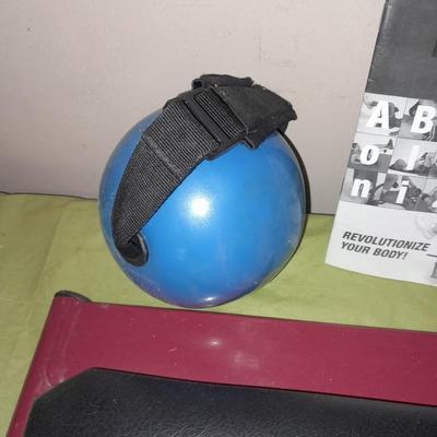 AB Revolutionizer Exercise machine and weighted strap on ball