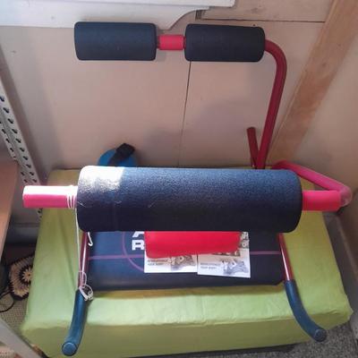 AB Revolutionizer Exercise machine and weighted strap on ball