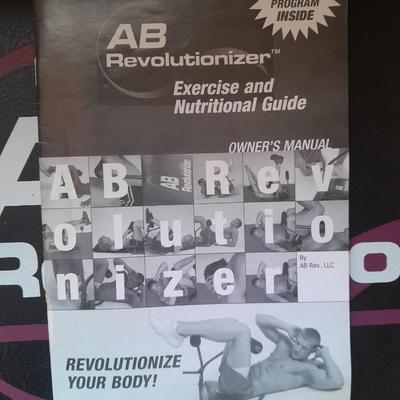AB Revolutionizer Exercise machine and weighted strap on ball