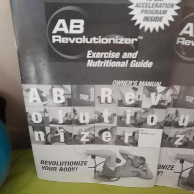 AB Revolutionizer Exercise machine and weighted strap on ball