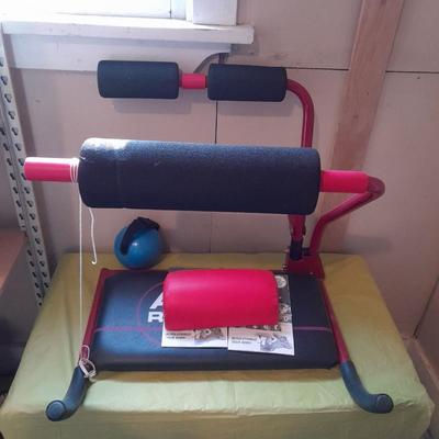 AB Revolutionizer Exercise machine and weighted strap on ball