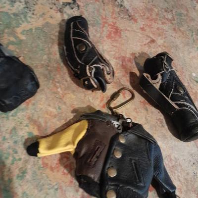 A whole bunch of leather keychains, golf bags, cars, leather jackets, and fanny packs
