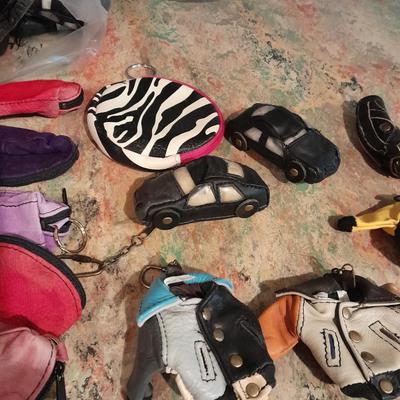 A whole bunch of leather keychains, golf bags, cars, leather jackets, and fanny packs