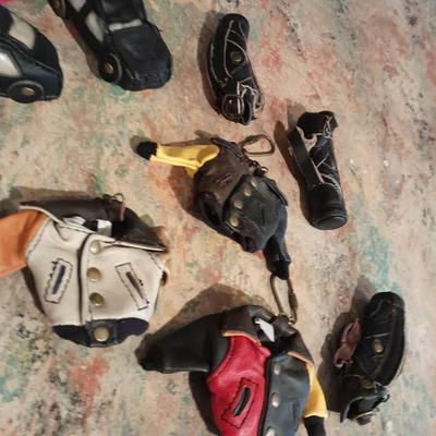 A whole bunch of leather keychains, golf bags, cars, leather jackets, and fanny packs
