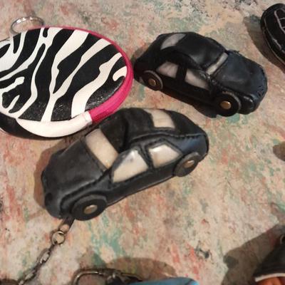 A whole bunch of leather keychains, golf bags, cars, leather jackets, and fanny packs