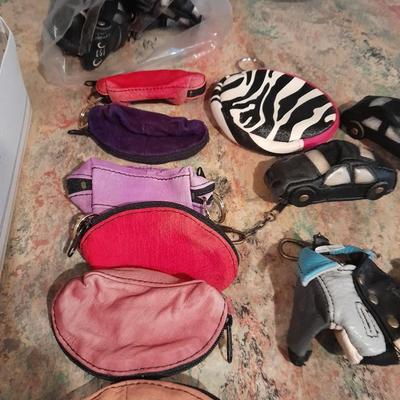 A whole bunch of leather keychains, golf bags, cars, leather jackets, and fanny packs