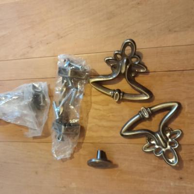 Tupperware organizer with lid, and an assortment of home hardware and lightbulbs