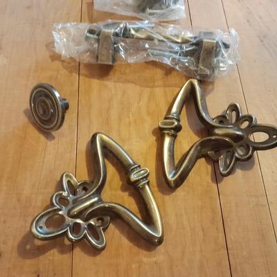 Tupperware organizer with lid, and an assortment of home hardware and lightbulbs