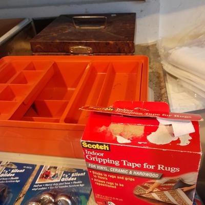 Tupperware organizer with lid, and an assortment of home hardware and lightbulbs