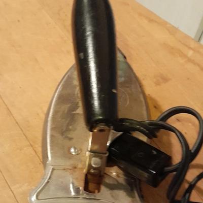 Antique wooden Ironing board and Vintage electric Clothes Iron with clothespins in bag