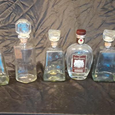 Empty Alcohol bottles with stoppers make wonderful vases!