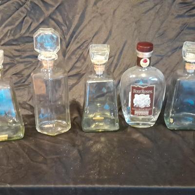 Empty Alcohol bottles with stoppers make wonderful vases!