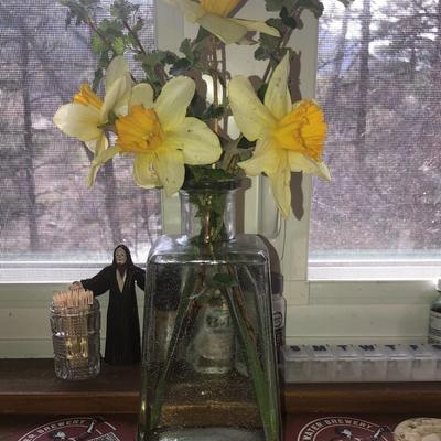 Empty Alcohol bottles with stoppers make wonderful vases!