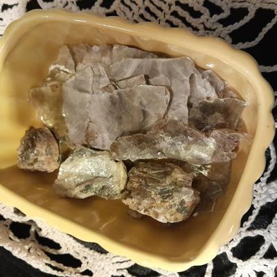 Decks of collectable cards, Dish full of Mica, and an assortment of trinkets and treasures