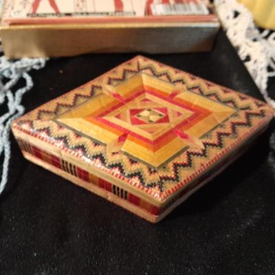 Decks of collectable cards, Dish full of Mica, and an assortment of trinkets and treasures