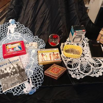 Decks of collectable cards, Dish full of Mica, and an assortment of trinkets and treasures