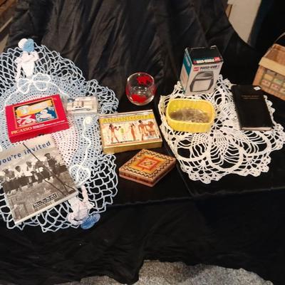 Decks of collectable cards, Dish full of Mica, and an assortment of trinkets and treasures