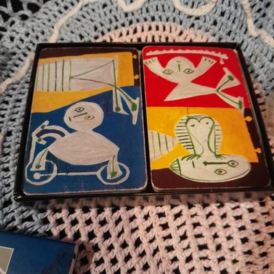 Decks of collectable cards, Dish full of Mica, and an assortment of trinkets and treasures