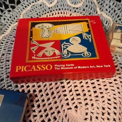 Decks of collectable cards, Dish full of Mica, and an assortment of trinkets and treasures