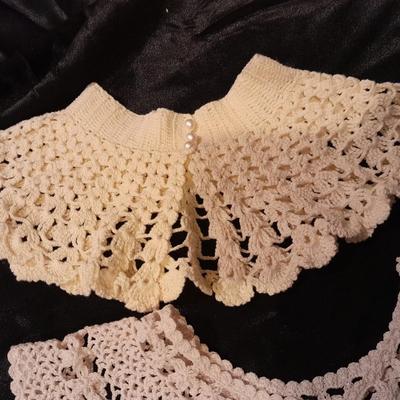 Vintage hand knit collars and a pair of white gloves.