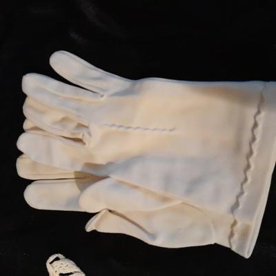 Vintage hand knit collars and a pair of white gloves.