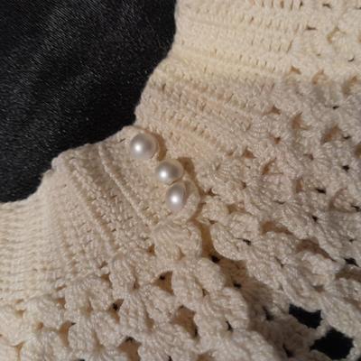 Vintage hand knit collars and a pair of white gloves.