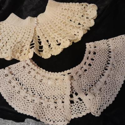 Vintage hand knit collars and a pair of white gloves.