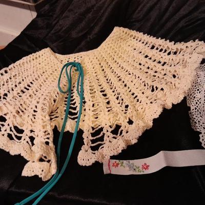 Vintage hand knitted collars and doily and a pair of white gloves