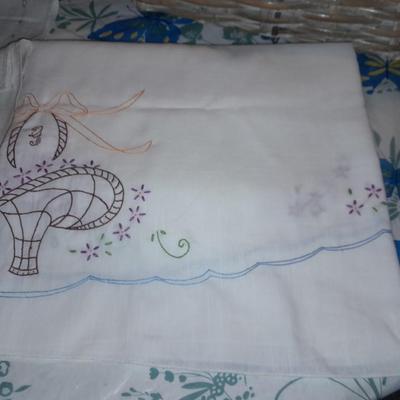 Table Linens, embroidered, napkins, and tablecloths.