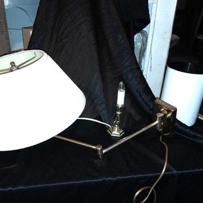 Wall mount Brass Lamp with shade, a free standing can light, and small candle light