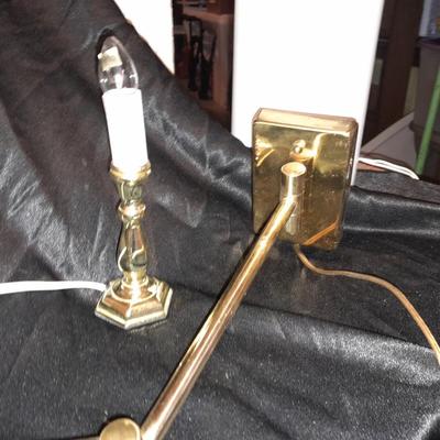 Wall mount Brass Lamp with shade, a free standing can light, and small candle light