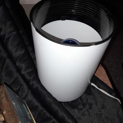 Wall mount Brass Lamp with shade, a free standing can light, and small candle light