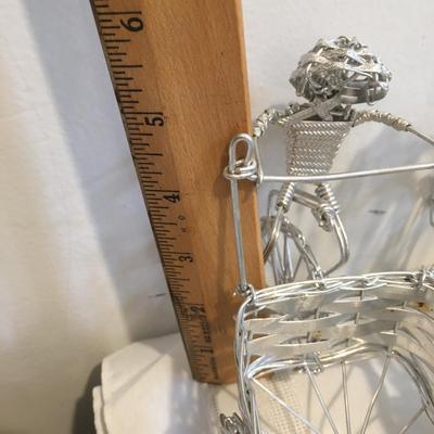 6 woven metal bicycles pulling baskets