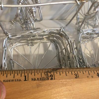 6 woven metal bicycles pulling baskets