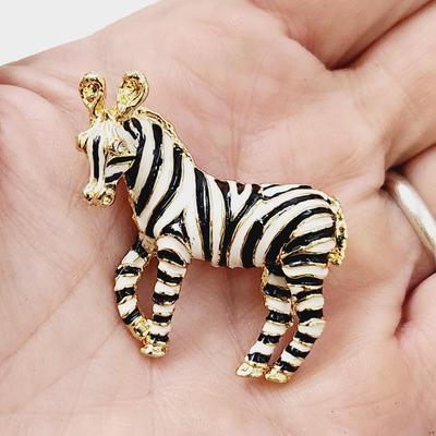 GOLD TONED ZEBRA PIN