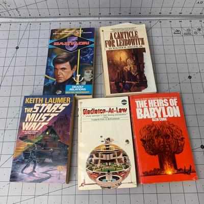 #293 The Stars Must Wait, The Heirs of Babylon and More Paperback Books