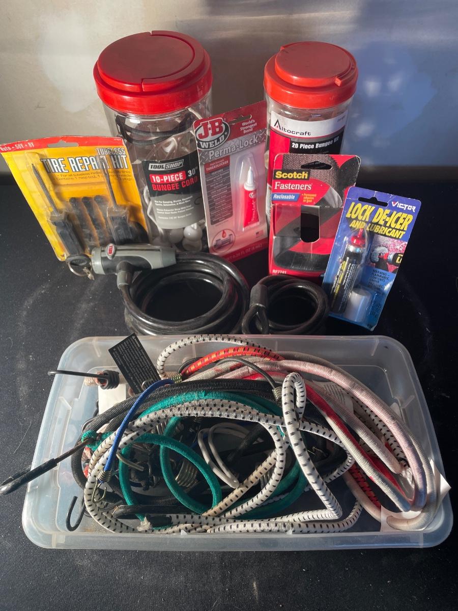Bungee cords, tire repair kit, lock deicer and fasteners