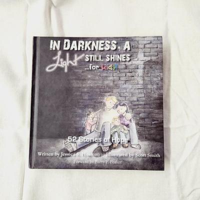 IN DARKNESS A LIGHT STILL SHINES FOR KIDS HARDBACK BOOK