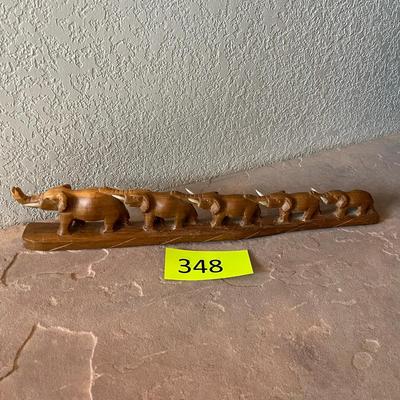 Wood carved March of Elephants
